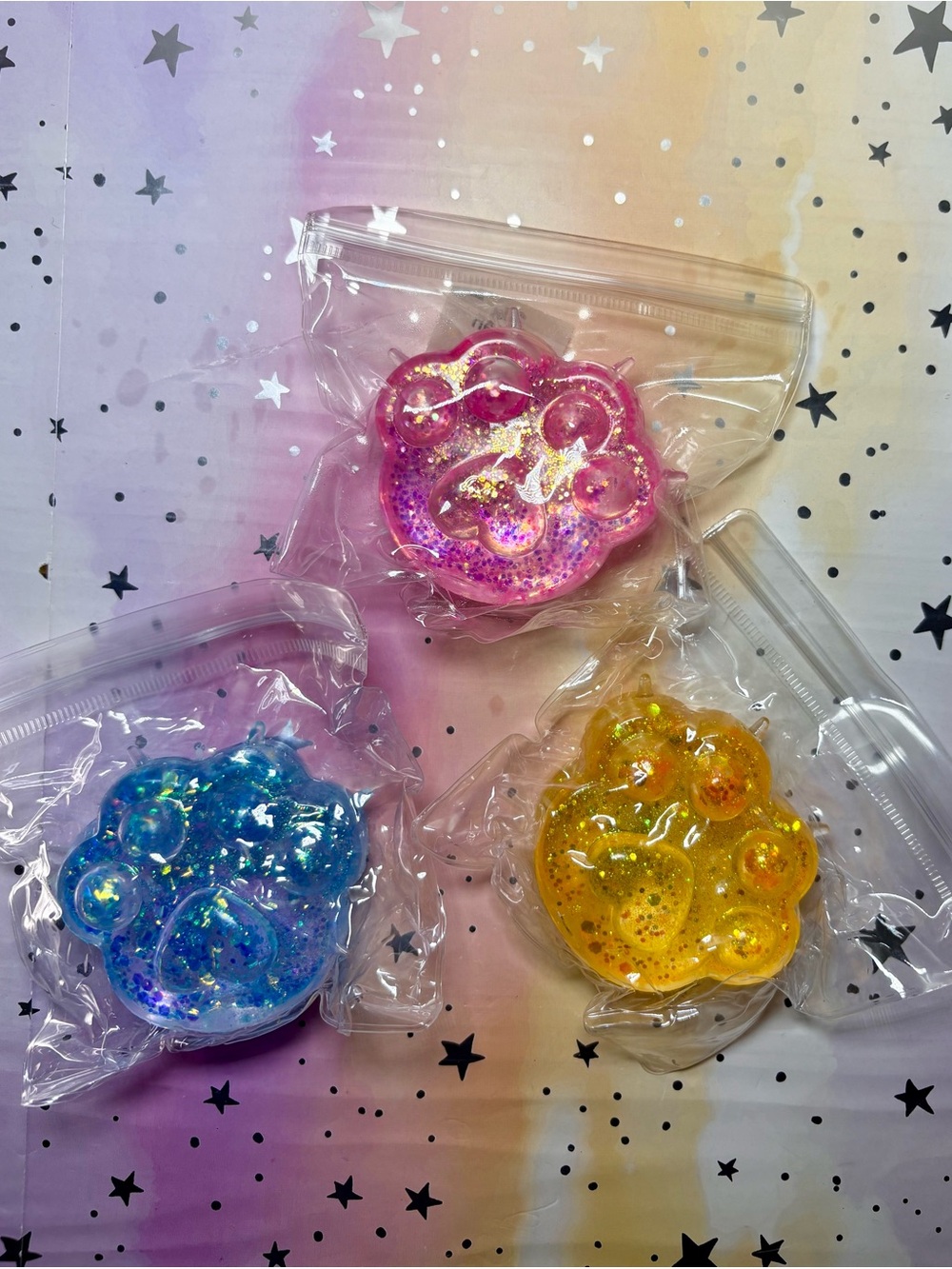 Petco Glitter Paw Print Squishy Set of 3 Pink Blue Yellow